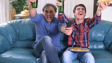 Watch TV at home 動画素材 77414574