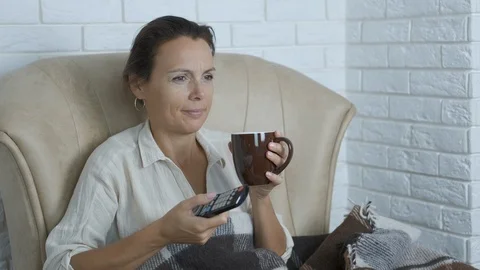 Watch TV with tea. Video stock 119108458