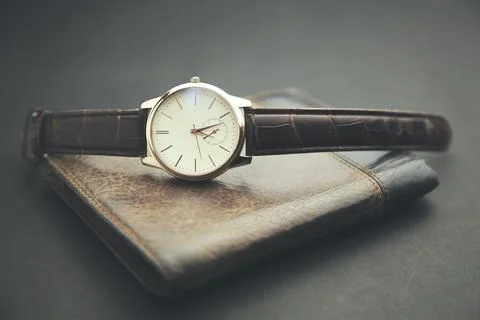 Watch on the  wallet Stock Photos