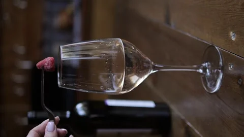 Watch white wine flow elegantly into crystal clear glass capturing the essence Stock Footage 273680045