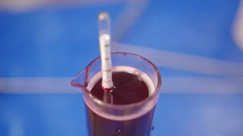 Watch the wine making test tube machine thermometer in action today Stock Footage 321405602