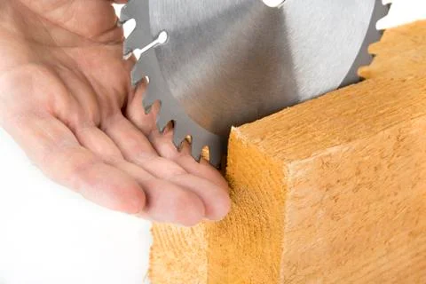 Watch your finger when using electric saw. Use protection tools concept Stock Photos