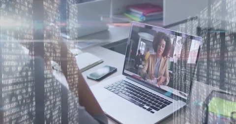Watching animation on laptop with digital data overlay in school setting Stock Footage 327846748
