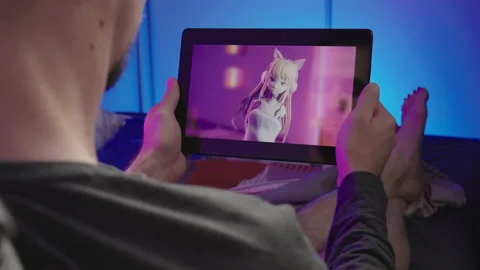 Watching anime tv show on tablet in bed Stock Video Pond5