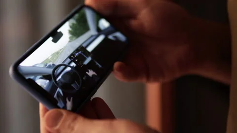 Watching autonomous autopilot self driving car on smartphone Stock Footage 193996521