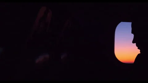 Watching a beautiful sunset from an airplane window during a flight Stock-Footage 312700228
