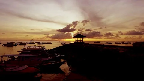 Watching the boats drift gently under the golden sunset Stock Footage 304257930