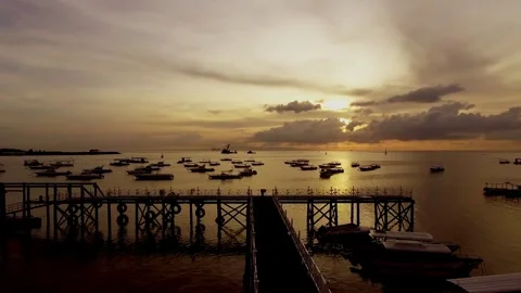 Watching the boats drift gently under the golden sunset Stock Footage 304257960
