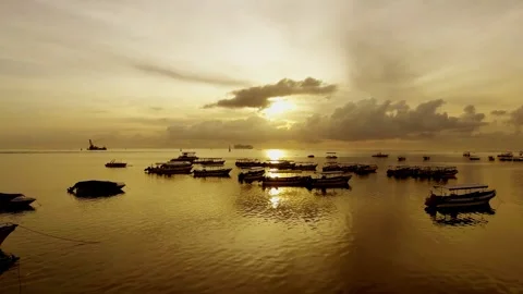 Watching the boats drift gently under the golden sunset Stock Footage 304257969