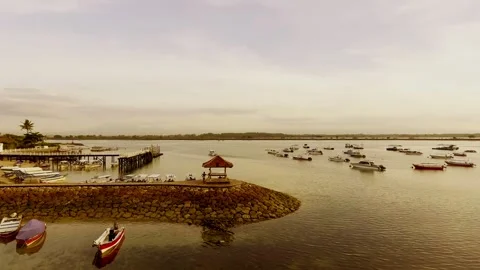 Watching the boats drift gently under the golden sunset Stock Footage 304257992