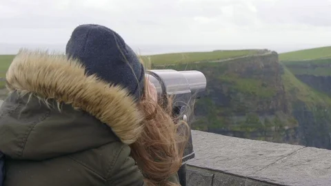 Watching the Cliffs of Moher in Ireland through a spyglass Stock Footage 95326024