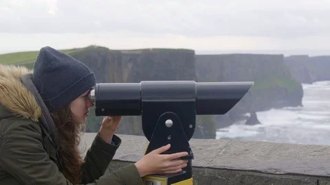 Watching the Cliffs of Moher in Ireland through a spyglass Stock Footage 95326357