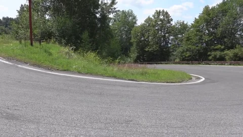 Watching driving from a car in a sharp turn in a mountain environment Stock Footage 280364148
