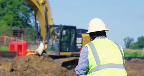 Watching Excavator at Work Stock Footage 201157508
