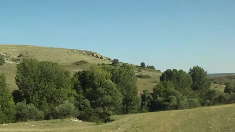 Watching the fields and the sky from the car window. Stock Footage 165369109