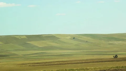 Watching the fields and the sky from the car window. Stock Footage 165369573