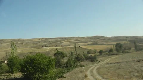 Watching the fields and the sky from the car window. Stock Footage 165369595