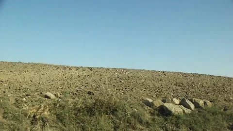 Watching the fields and the sky from the car window. Stock Footage 165369707