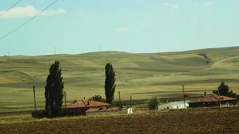 Watching the fields and the sky from the car window. Stock Footage 165370439