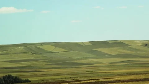 Watching the fields and the sky from the car window. Stock Footage 165370475