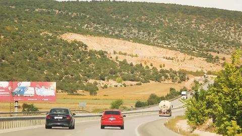 Watching the fields and the sky from the car window. Stock Footage 165375618