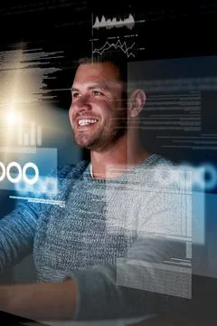 Watching his code in action. Shot of a smiling computer programmer working at Stock Photos