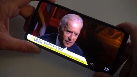 Watching Joe Biden Interview at CBS This Morning on 21 June 2016 Stock Footage 119767325