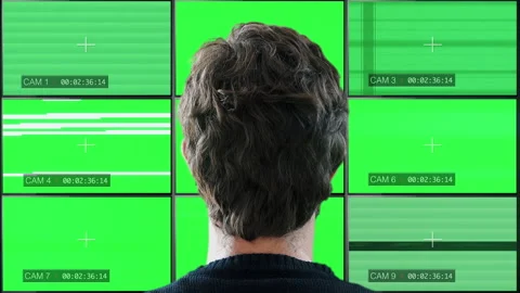 Watching Multiscreen Monitors Green Screen TV static Video stock 141256300