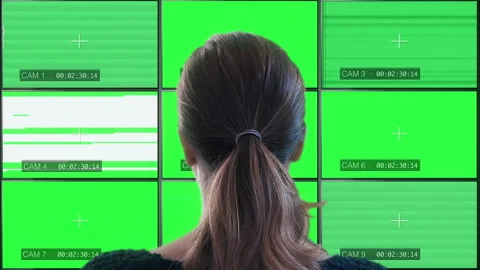 Watching Multiscreen Monitors Green Screen TV static Video stock 141257684