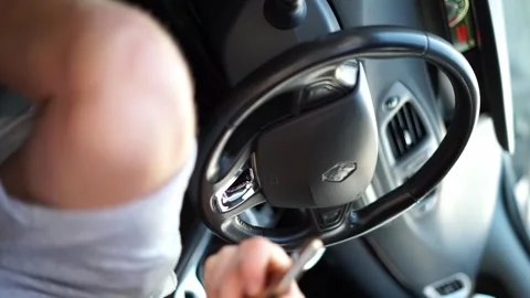 Watching phone while driving vertical video Stock Footage 257746110
