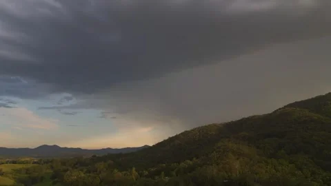 Watching Rain Clouds Roll In Over Golden Horizon 스톡 동영상 267800015