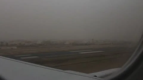 Watching safe landing through plane window Stock Footage 12170289