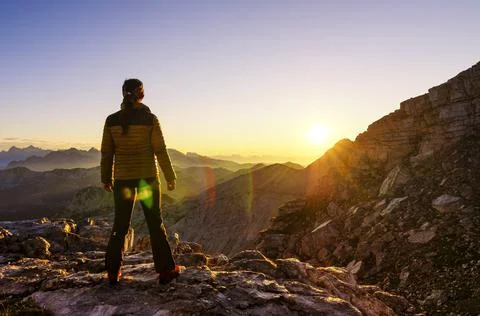 Watching sunrise in the mountains Stock Photos