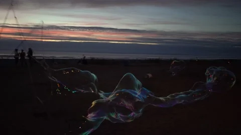 Watching Sunset and Bobble Show at Seaside City Pacific Ocean Beach, Oregon Stat Stock Footage 214062452