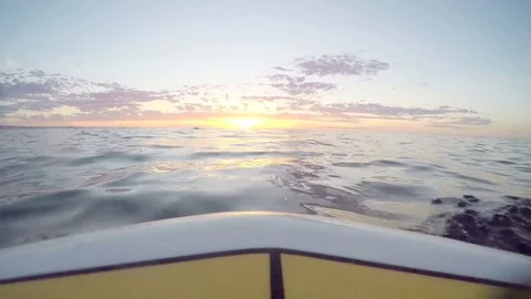Watching the sunset over the calm ocean Stock Footage 77390041