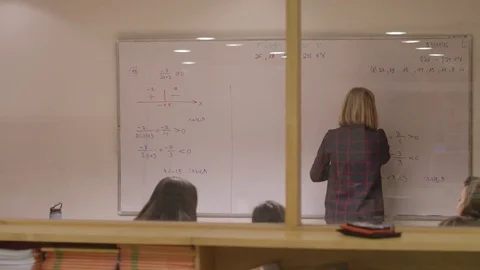 Watching teacher through window erasing white board Stock Footage 81203839