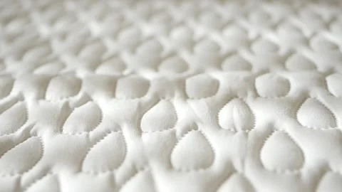 Watching the texture of a soft mattress close up Stock Footage 341648119