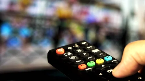 Watching TV and using remote controller Stock-Footage 55392527