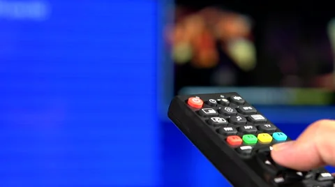 Watching TV and using remote controller Stock-Footage 55392652