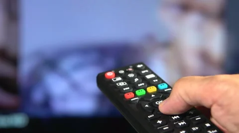 Watching TV and using remote controller Stock-Footage 55392670