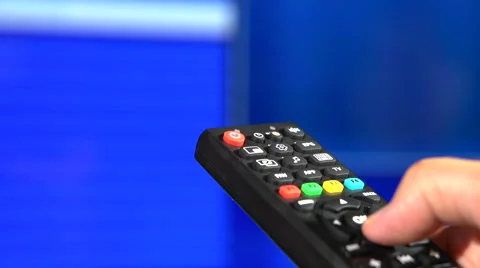 Watching TV and using remote controller Stock Footage 55392683