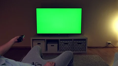 Watching tv with green screen at home in... | Stock Video | Pond5