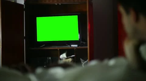 Watching TV greenscreen Stock Footage 12334181