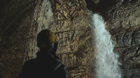 Watching Waterfalls Inside Cave Stock Footage 116494221