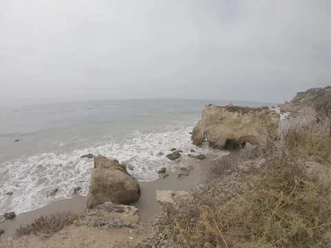 Watching Waves Crash Below onto Cloudy California Coastline 4k 4:3 Stock Footage 92932254