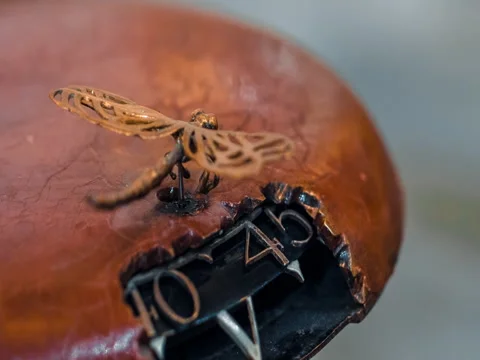 Watchmaker Adjusting Peacock Clock Video stock 73449513