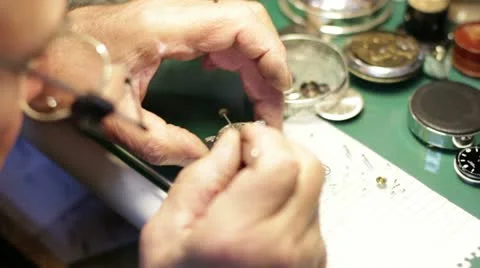 Watchmaker assembles a watch Stock Footage 21440291