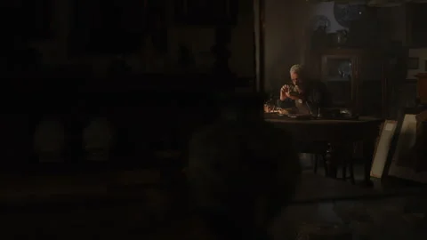 Watchmaker checking an item using the magnifying glass Vídeo Stock 258302974