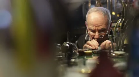 Watchmaker checks the operation of a repair Stock Footage 21439932