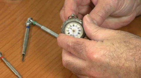 Watchmaker examine pocket watch Stock Footage 670682